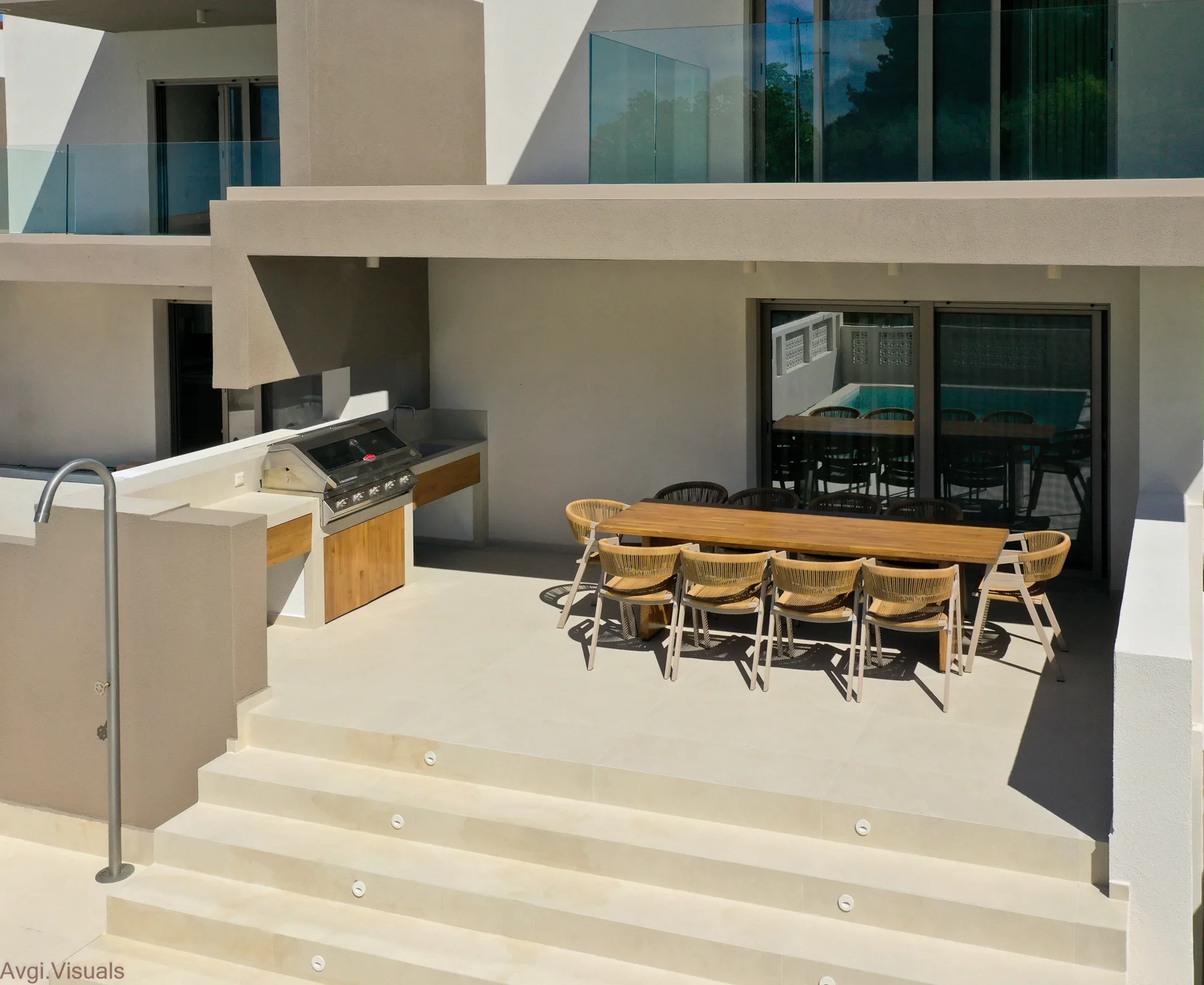 Aerial exterior photograph of a modern villa dining terrace by Avgi Chourlia
