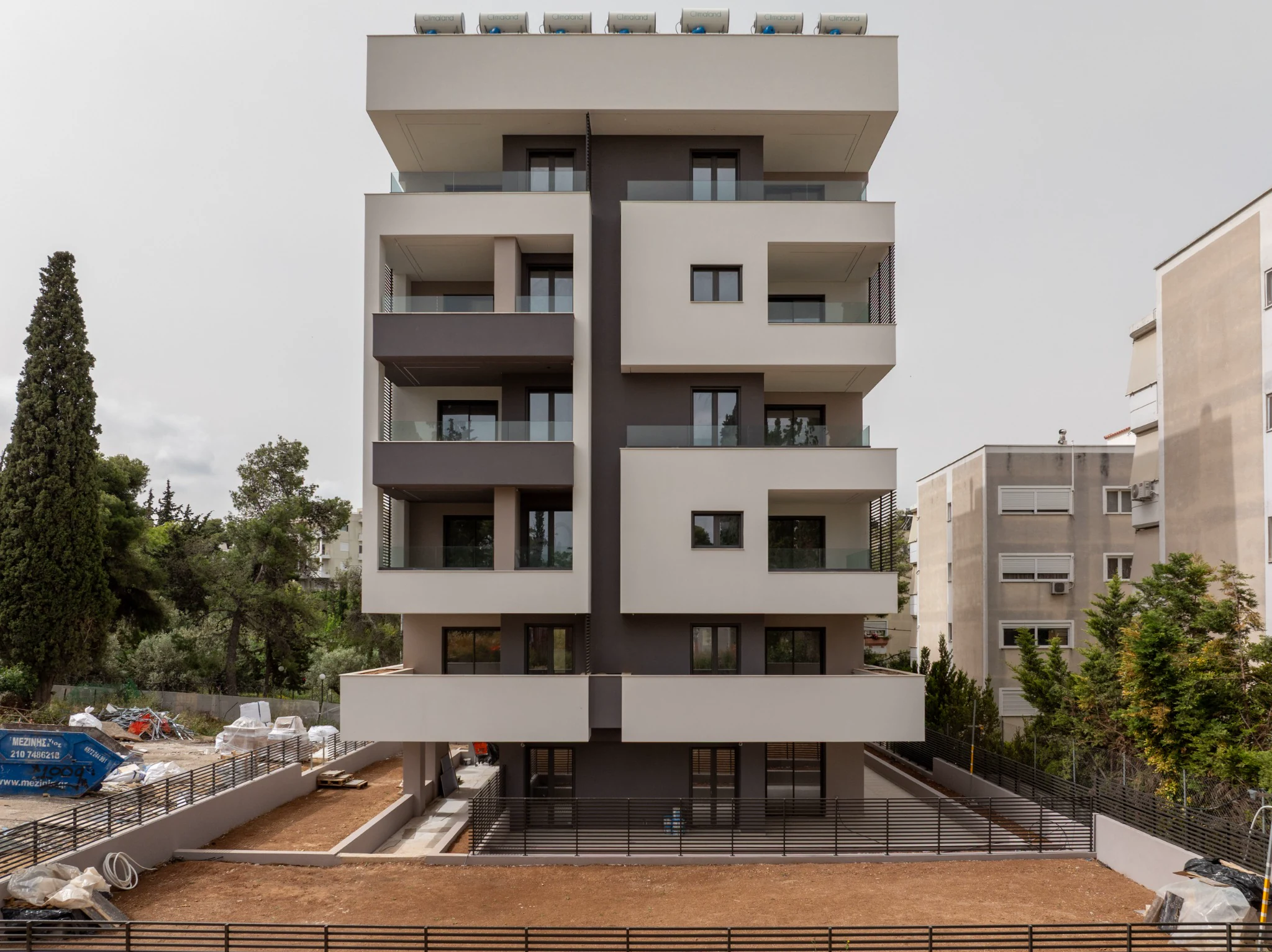 Aerial photograph of a modern residential building by Mike Pavlou