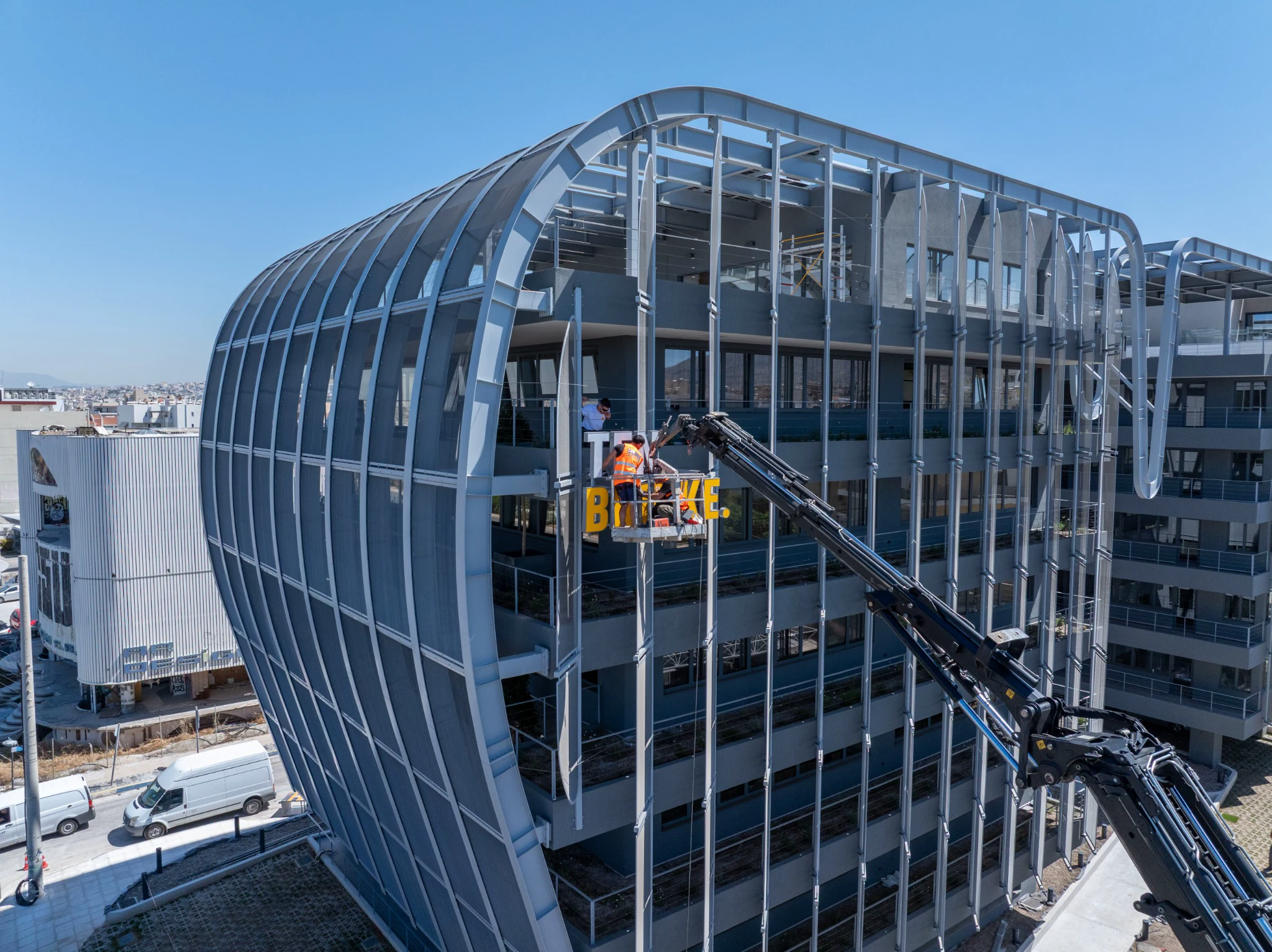 Aerial documentation of construction work on a modern commercial building by Mike Pavlou