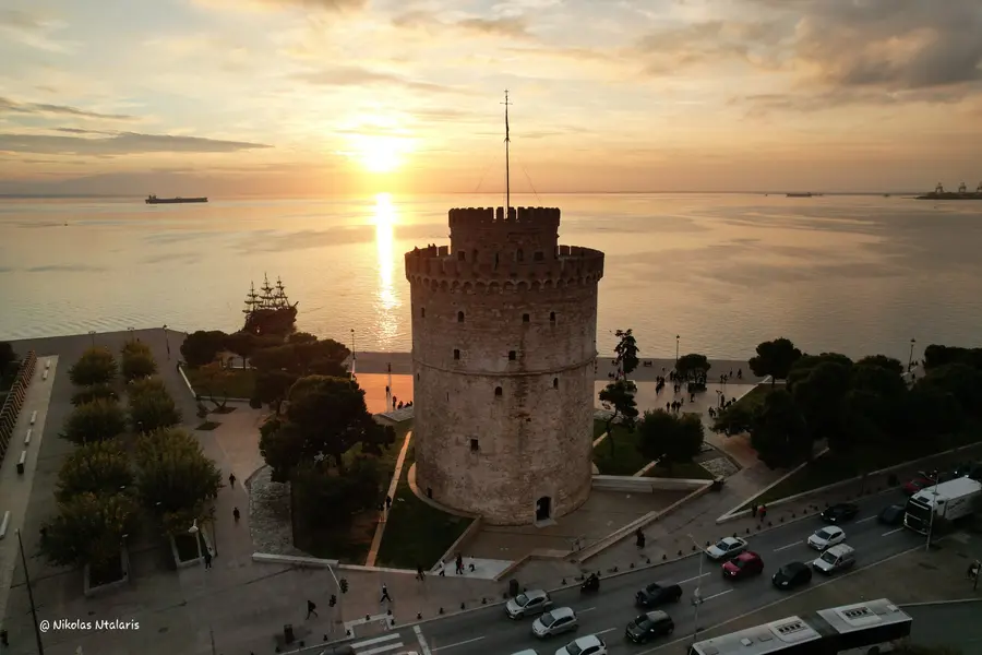 Aerial sunset photograph of the White Tower and Thessaloniki waterfront by Nikolas Ntalaris