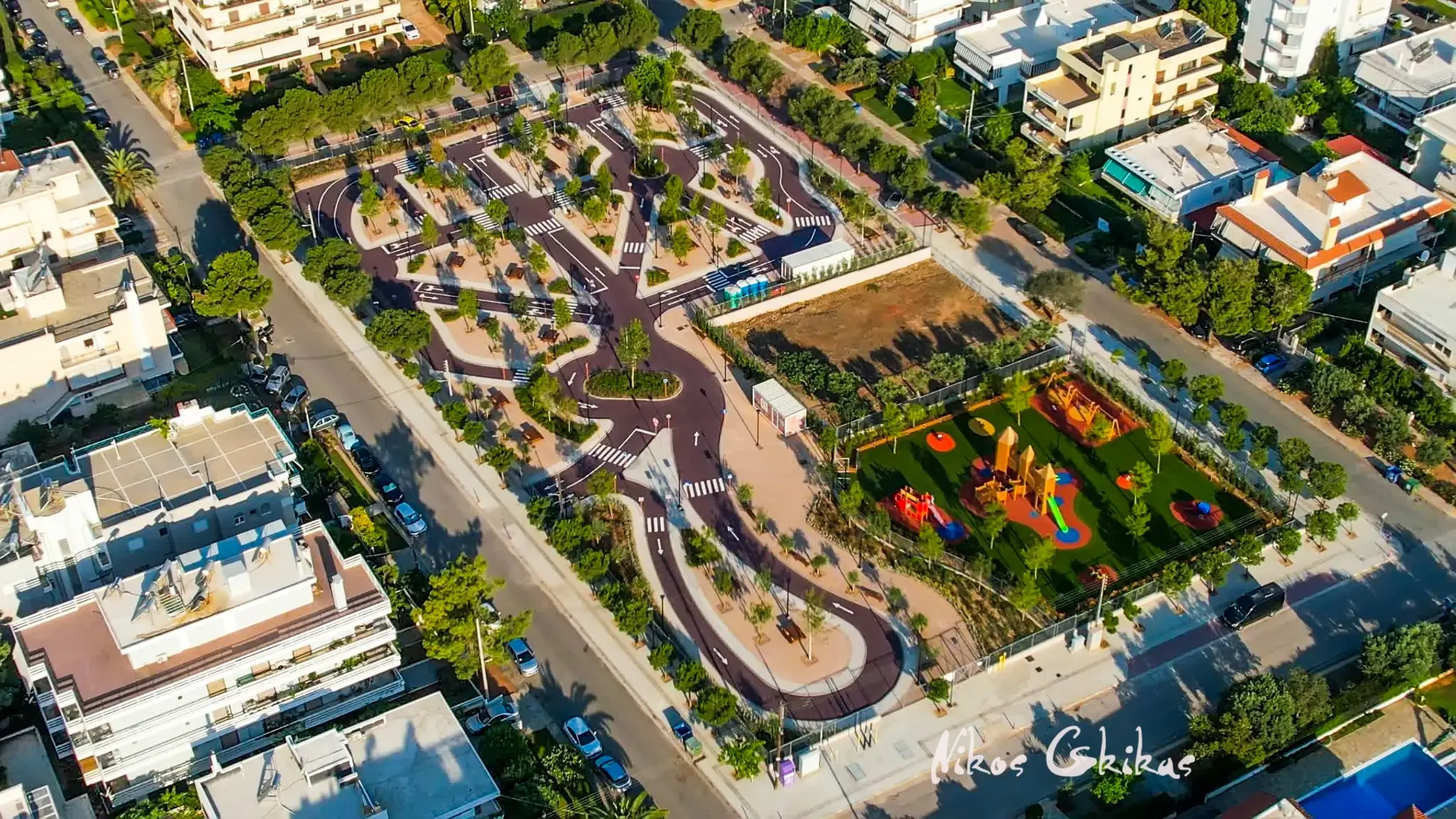 Aerial photograph of an urban traffic education park and playground by Nikos Gkikas