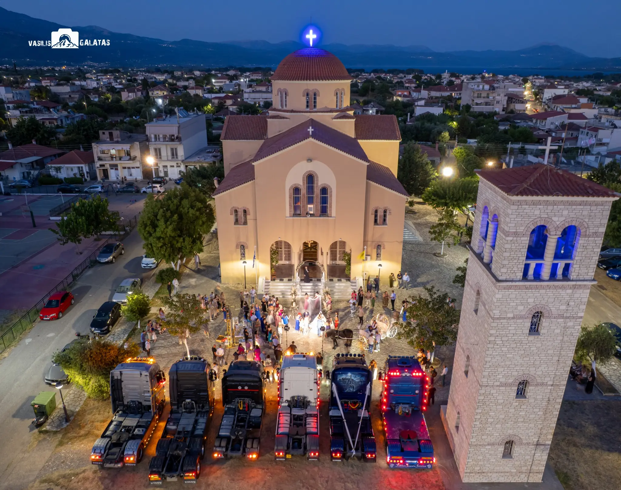 Aerial wedding event photograph outside a church by Basilis Galatas